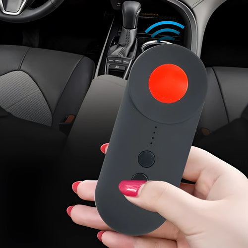 Black portable GPS and WiFi signal detector with laser scanner for hidden cameras on a table.