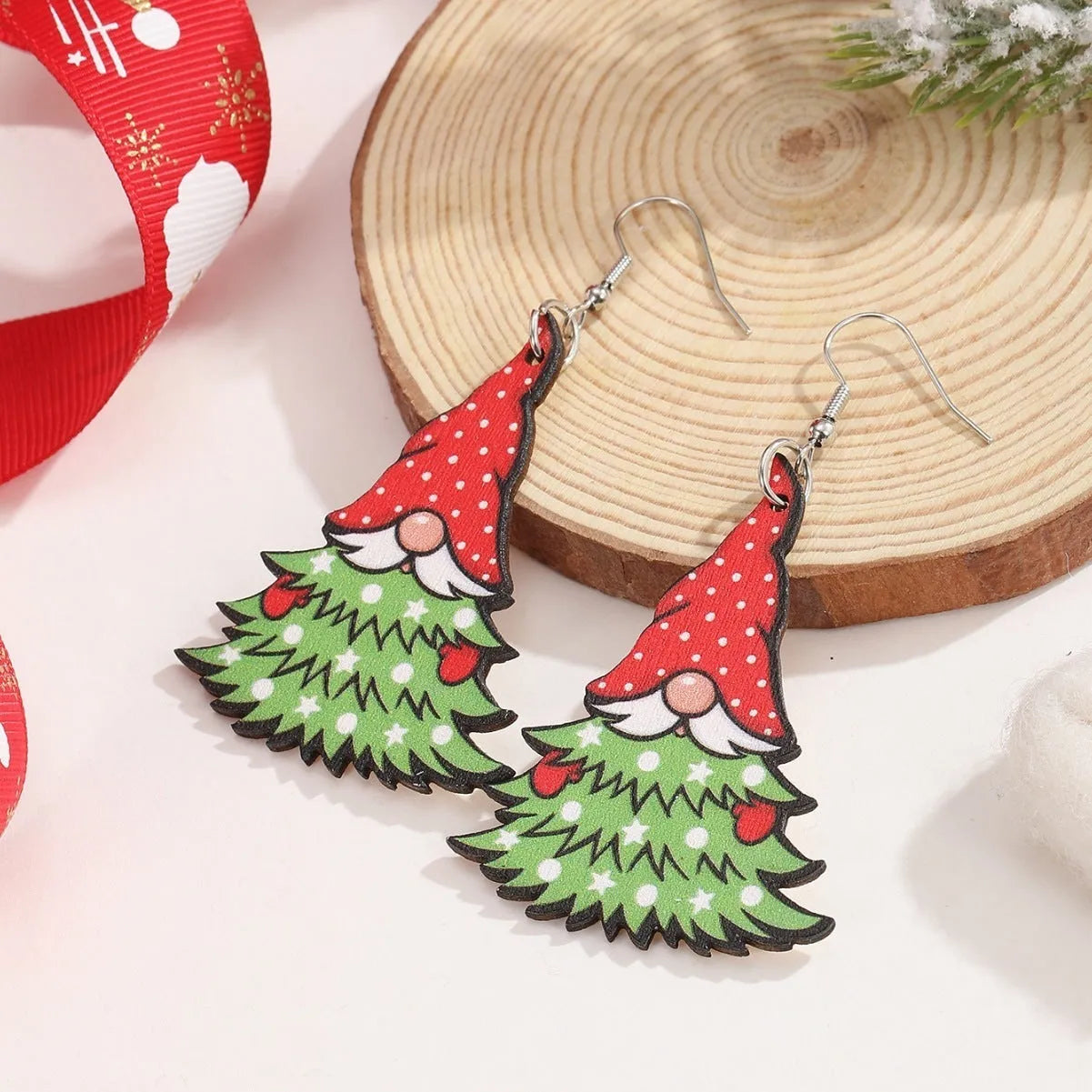 Wooden Christmas earrings with geometric shapes and printed Santa Claus holiday designs