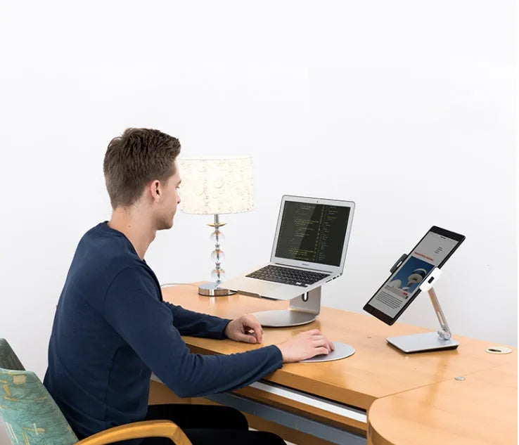 Folding desktop phone tablet stand in silver with 360-degree rotation feature