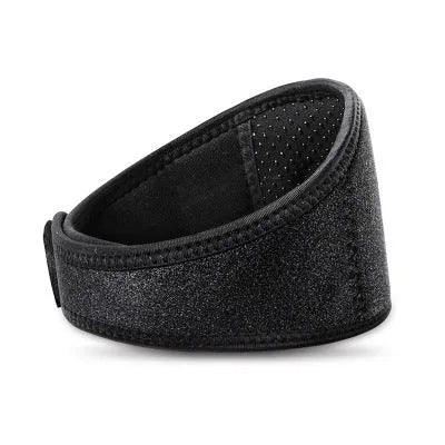 Black self-heating magnetic therapy neck guard with adjustable shoulder strap laid flat