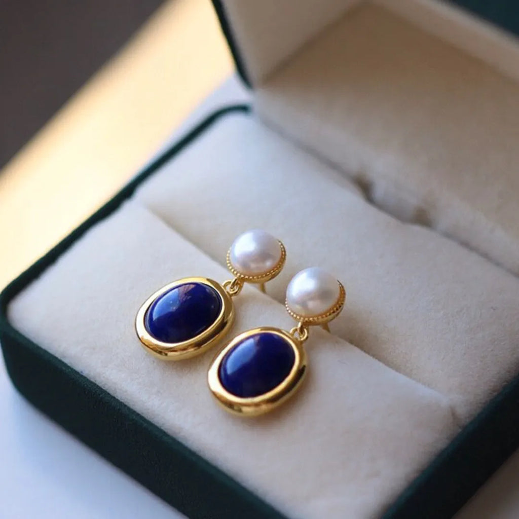 Silver earrings with blue lapis lazuli pearls and auspicious pattern details