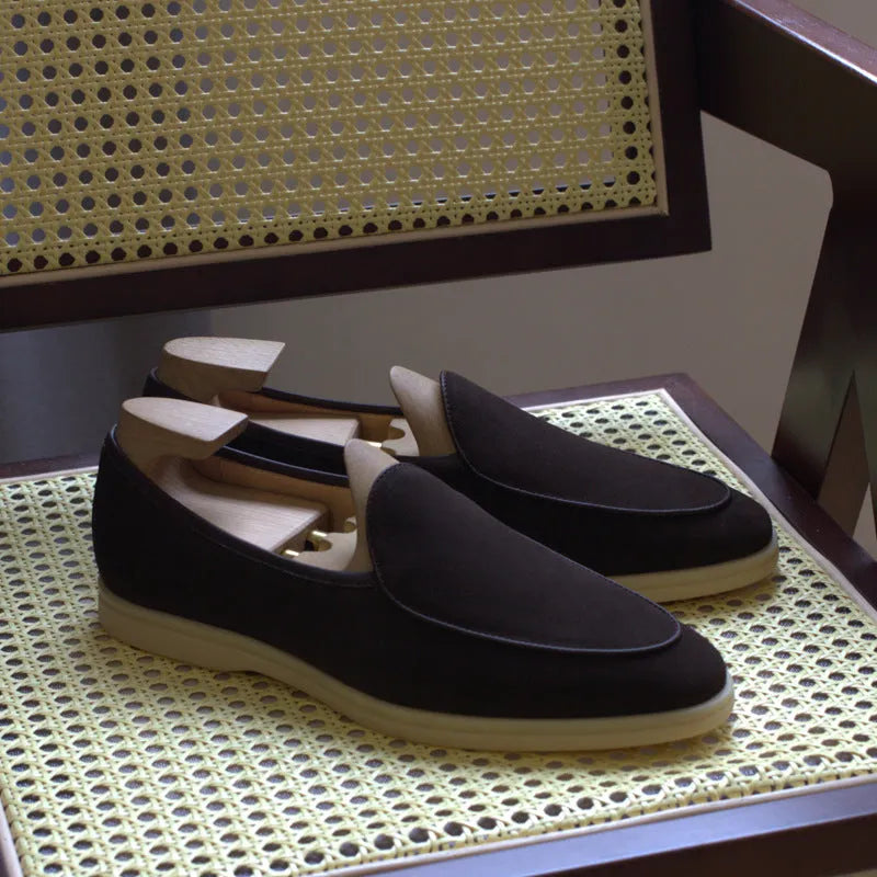 Men's handmade brown leather loafers with a low cut and textured TPR sole.