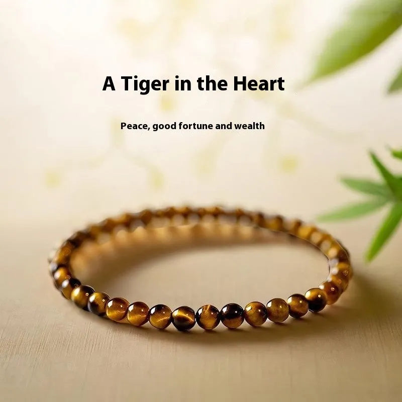 Tigereye stone bracelet with geometric Chinese style design showing round bead elements