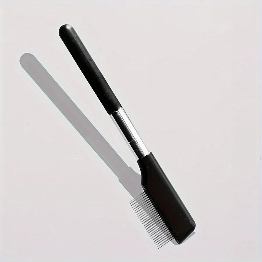 Black ambidextrous pet grooming brush with soft bristles and a fine-tooth comb for dogs and cats.