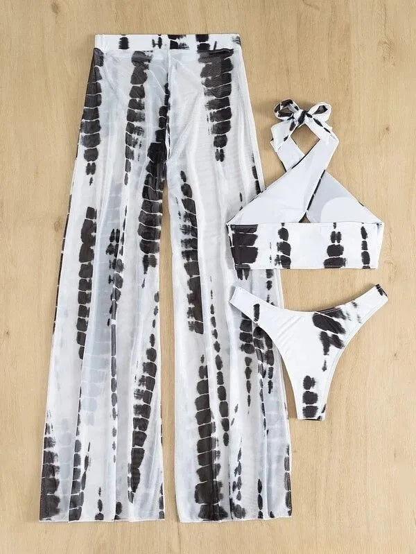 Women's three-piece swimsuit set showing bikini top, underpants, and mesh trousers in printed fabric