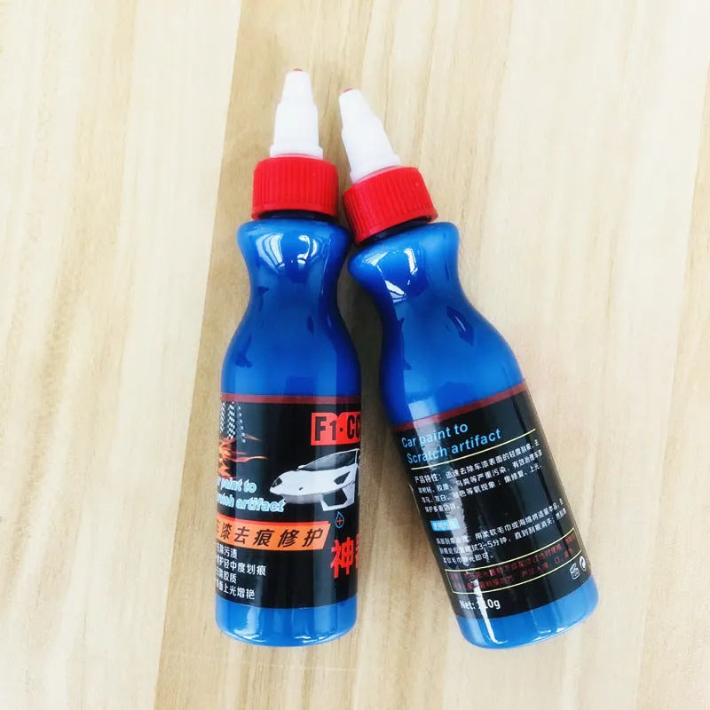 Blue car wiping tool with microfiber applicator and scratch repair agent bottle for automotive paint damage