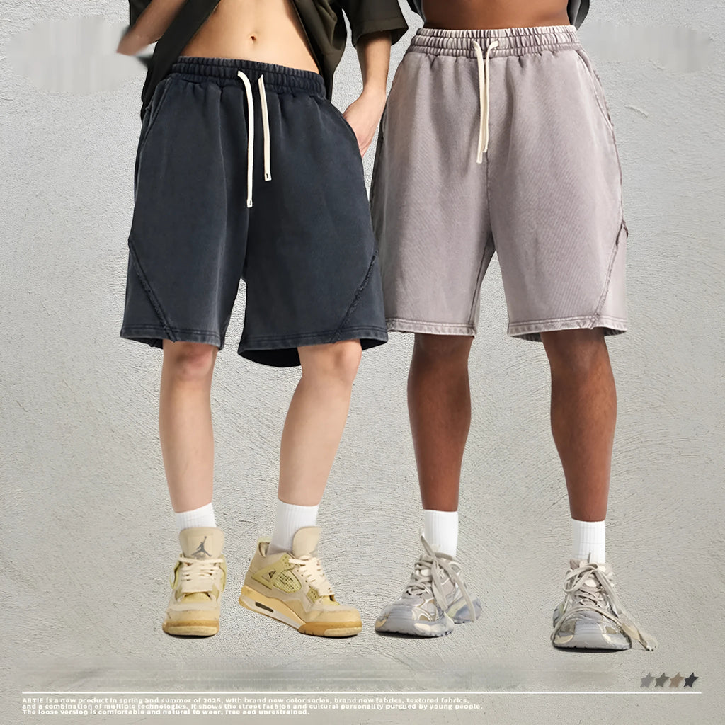 Men's loose-fit retro shorts in batik-washed cotton terry fabric, shown in a batik black colour.