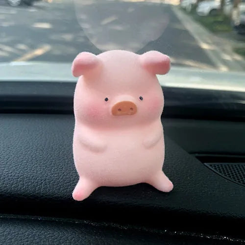 Colourful 3D resin cartoon pig figurine car decoration on a car dashboard