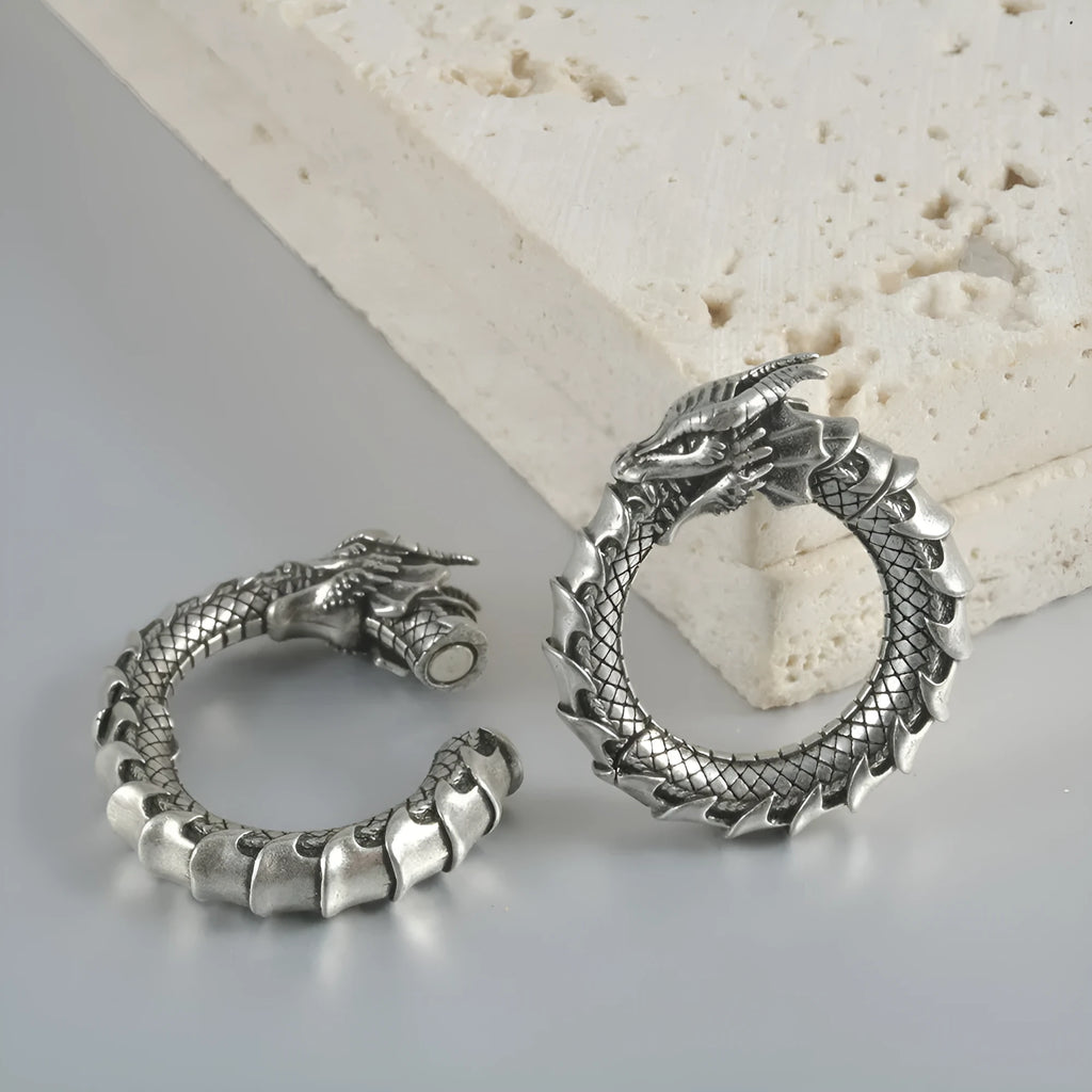 Geometric hollow-out stainless steel earrings with large copper auricle shape in antique silver dragon finish.