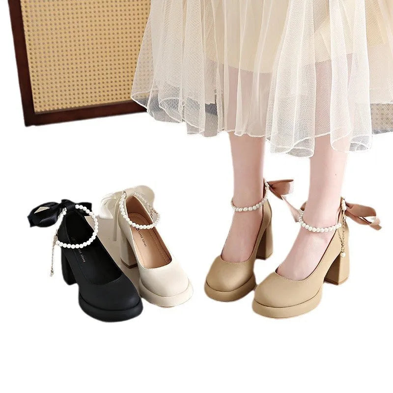 Women's beige Mary Jane shoes with a chunky heel and silver ankle-strap buckle on a round toe PU upper.