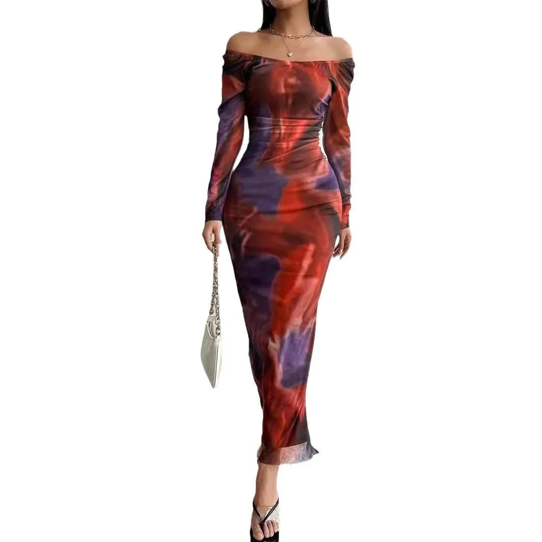 Woman wearing a printed gradient colour mesh fishtail dress with pleats and a square collar