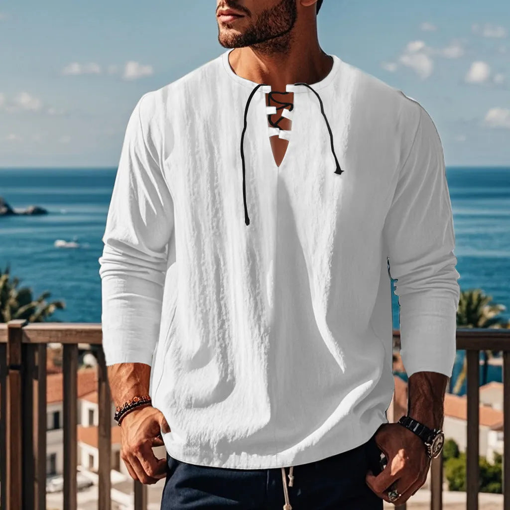 Cotton linen beach ruff shirt in a loose pullover style on a hanger.