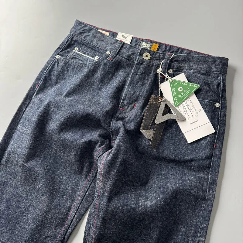 Men's straight leg denim trousers in primary colour with classic five-pocket styling