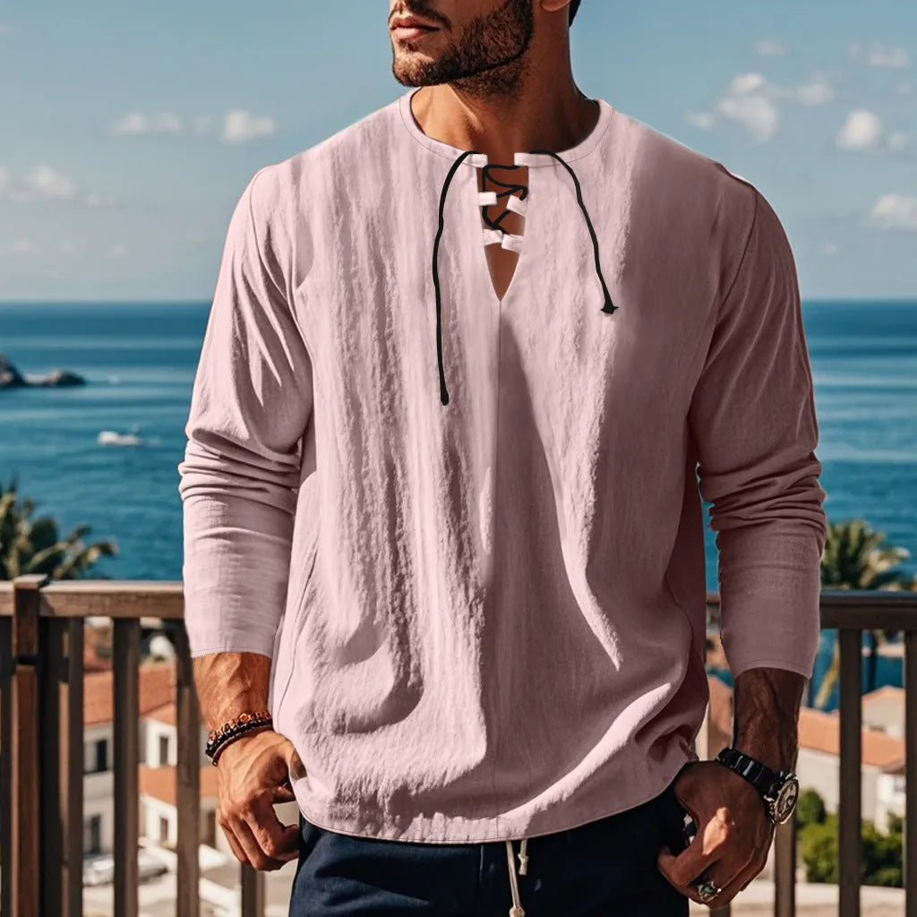 Cotton linen beach ruff shirt in a loose pullover style on a hanger.