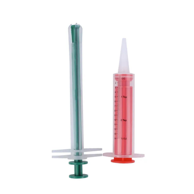 Two silicone pet pill shooter syringes with soft tips on a white background