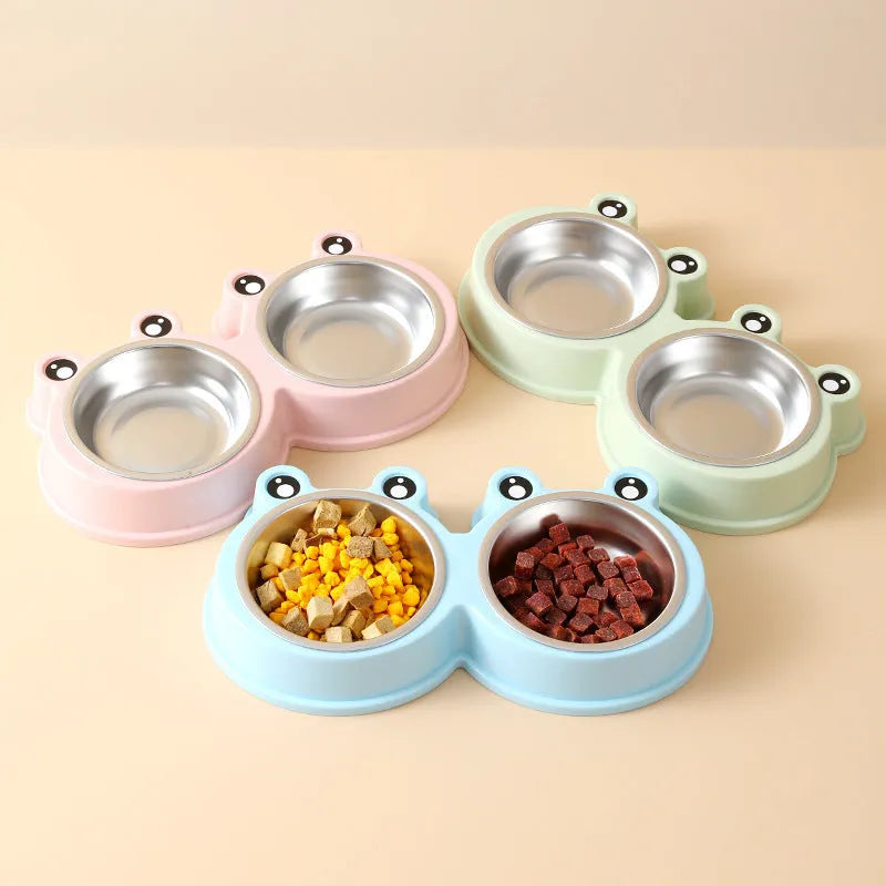 Blue stainless steel double bowl pet feeder with frog-shaped centrepiece for cat or dog food and water.