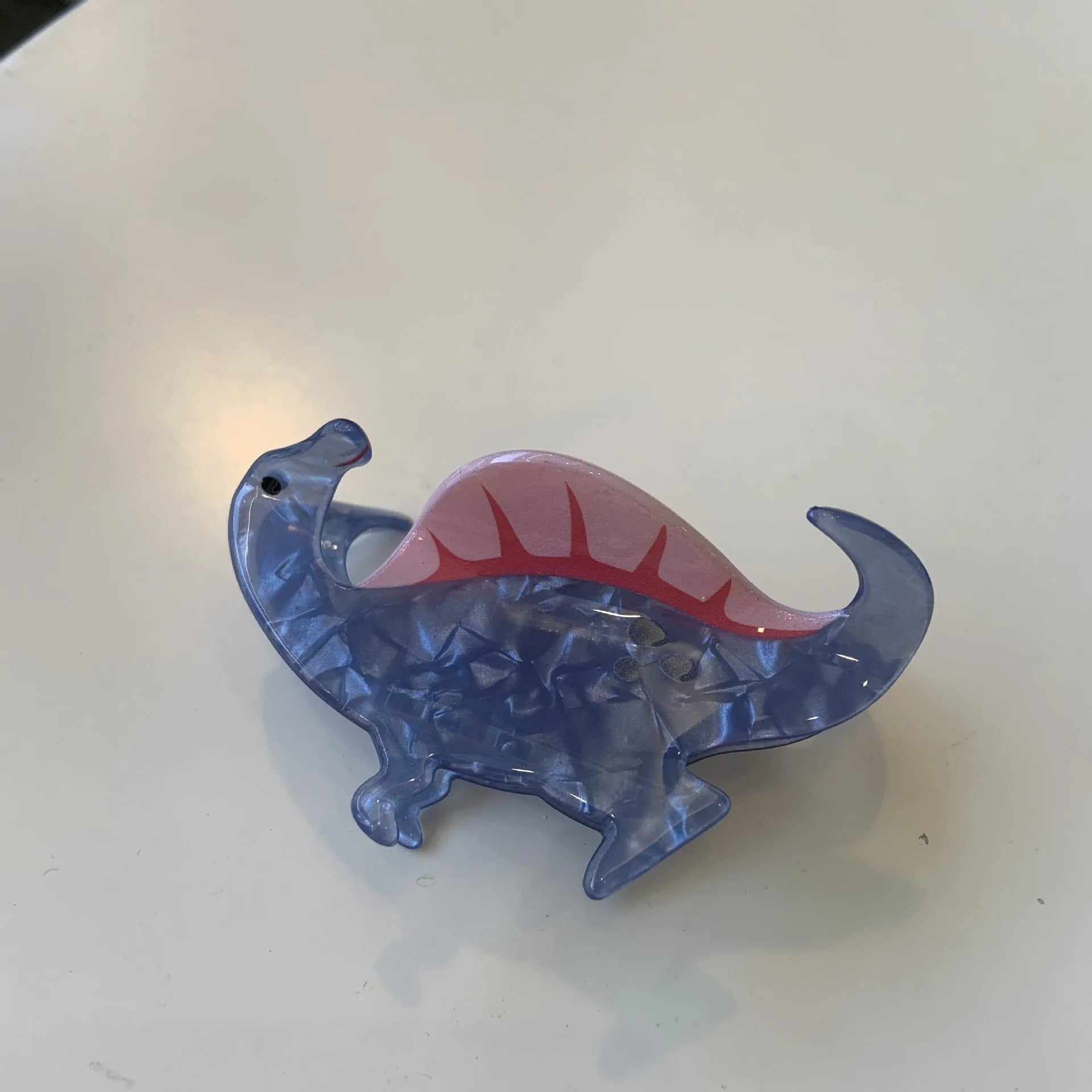 Dinosaur acrylic jaw hair clip showing grip mechanism and detailed dinosaur design in available colour options