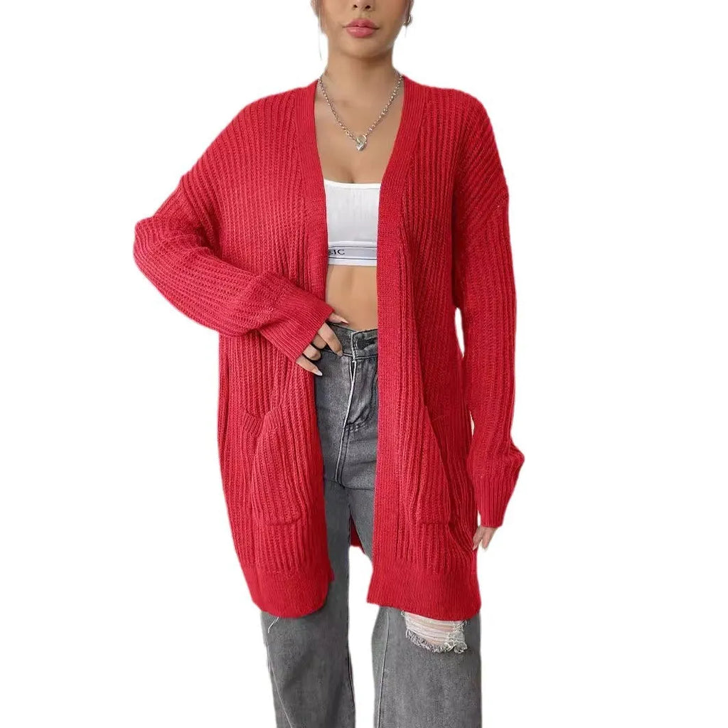 Loose fit women's acrylic cardigan sweater with double pockets in solid color