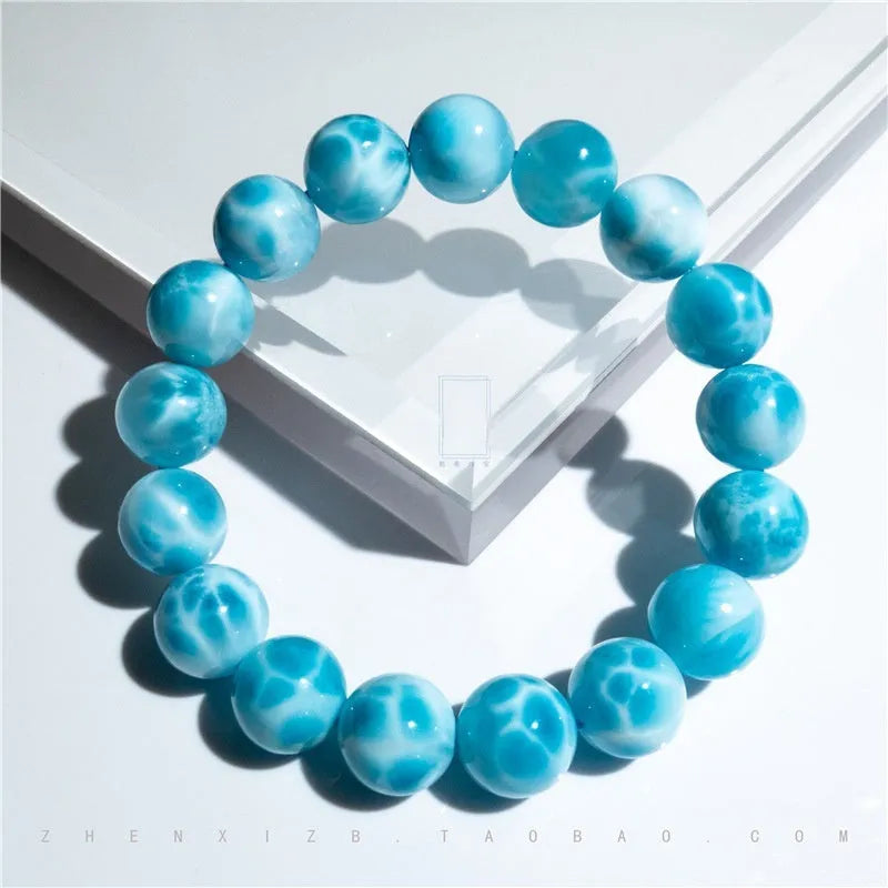 Blue Maillard style bodhi bracelet with natural crystal, sea-pattern stone, and a pearl bead.
