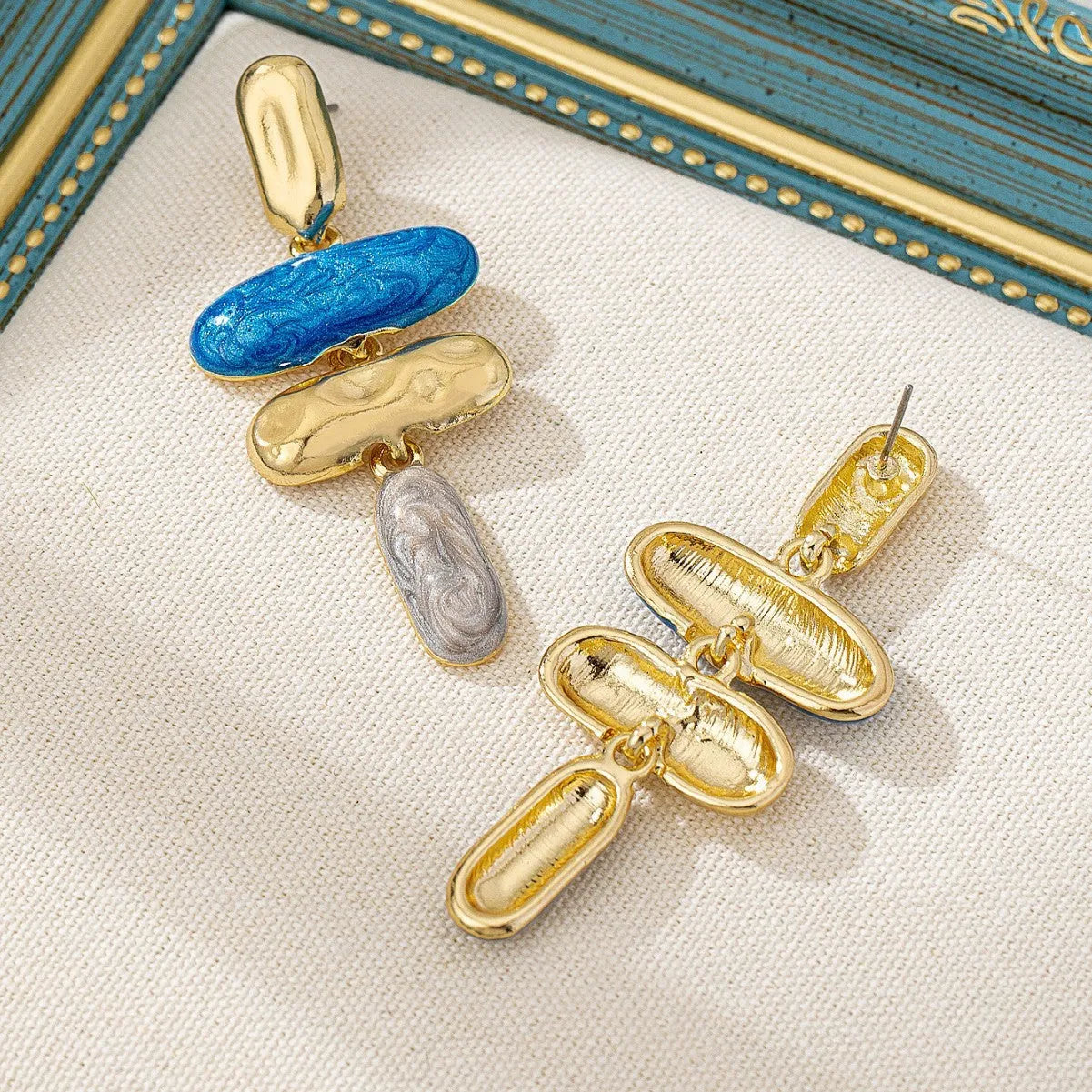 Geometric zinc alloy stud earrings with electroplated multicolour finish