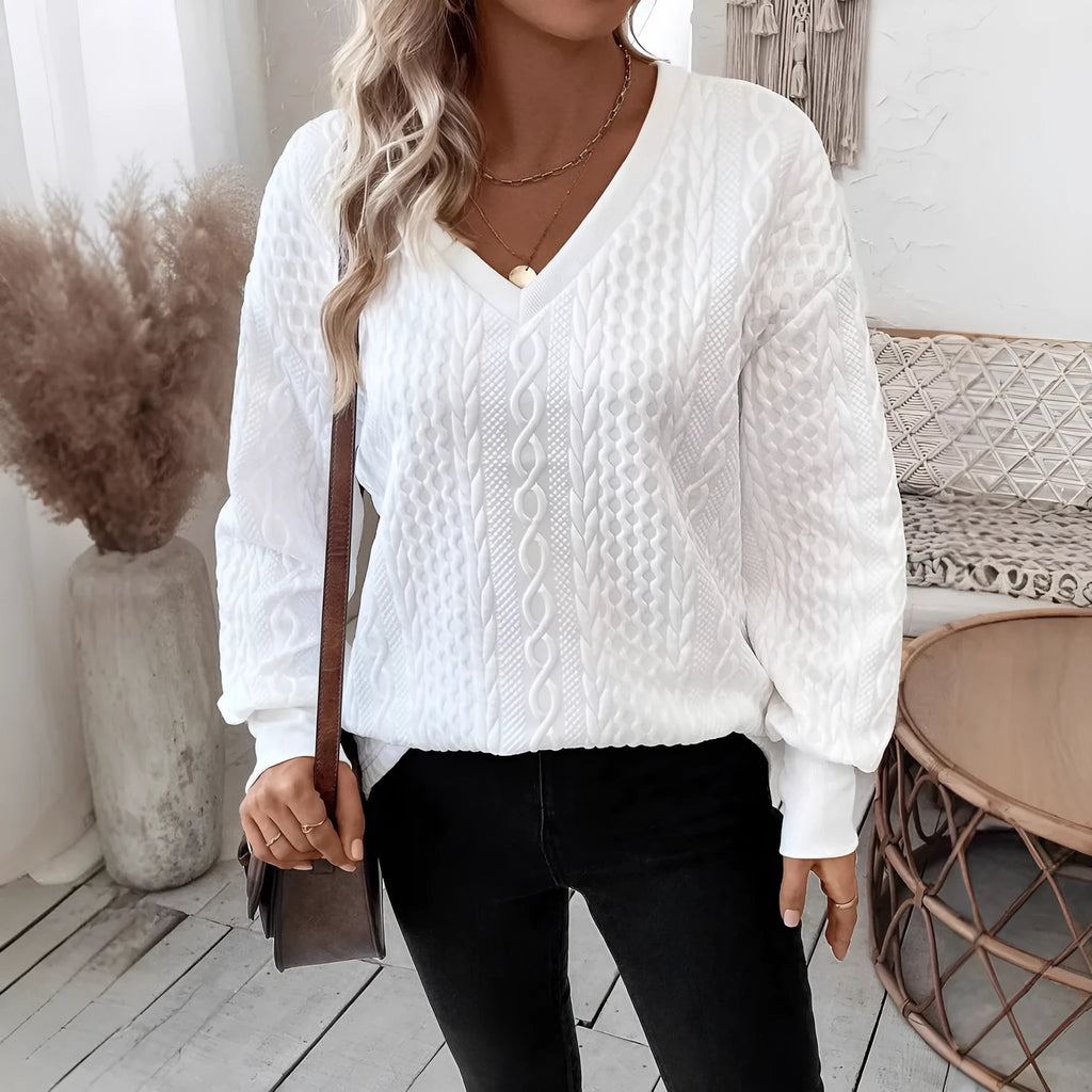 Milky white loose fit casual t-shirt with a raised 3D pattern on the front.