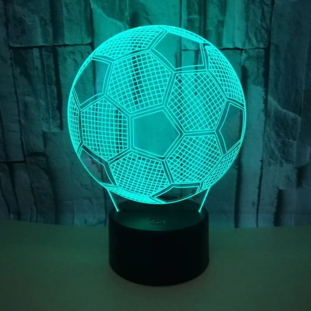 3D football shaped night light with colourful LED illumination on a black ABS base.