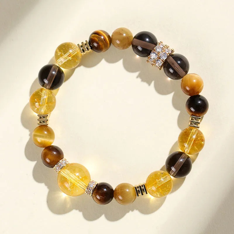 Women's natural yellow 10mm artificial crystal string beads bracelet on wrist.