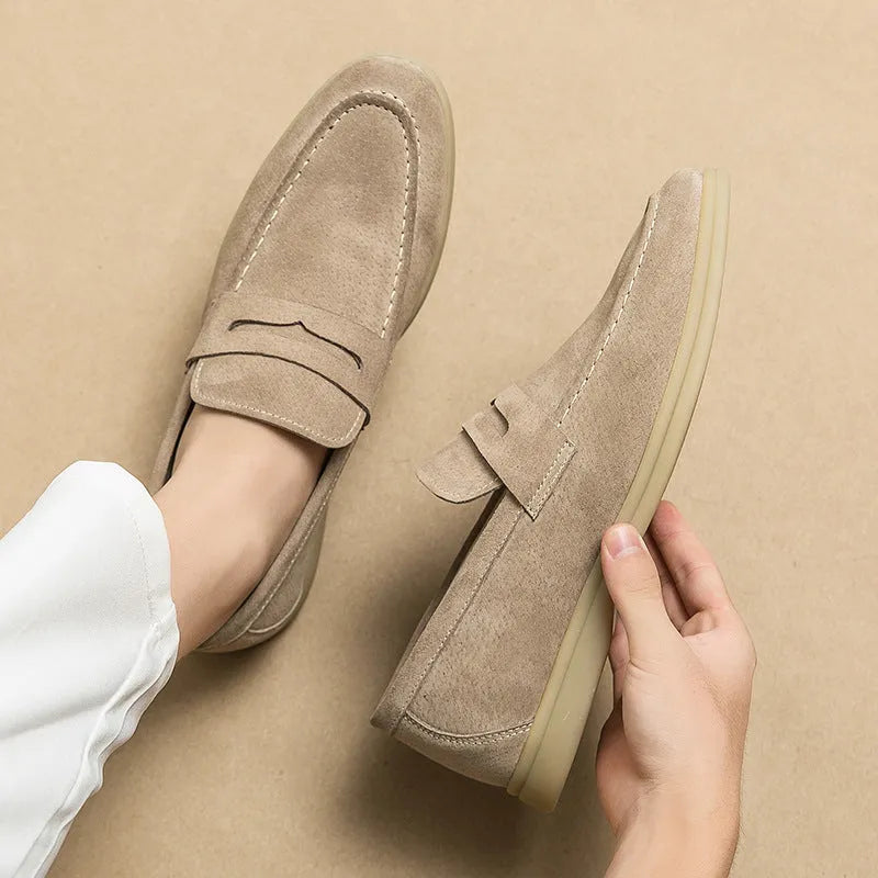 Men's black slip-on leather casual shoes with round toe and a mid-height rubber sole.