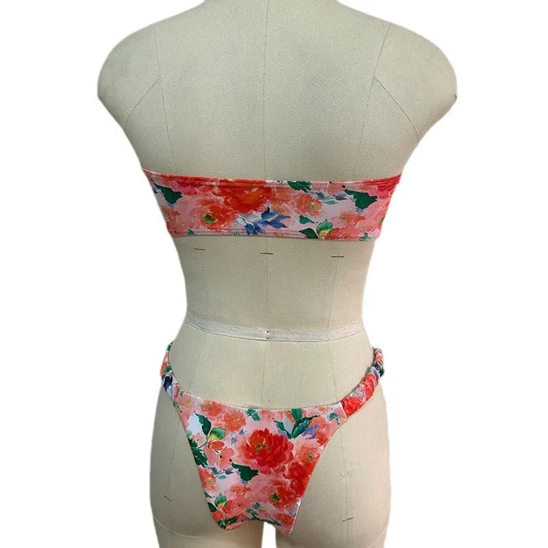 Women's floral print bikini set with lace trim on tube top and briefs in blue colour