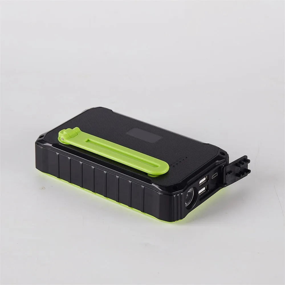 Orange and green hand crank solar power bank with 12000mAh capacity, dual USB ports, and a solar panel.