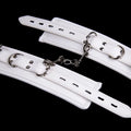White PU sponge bondage restraint set showing wrist cuffs, ankle cuffs and neck cuff