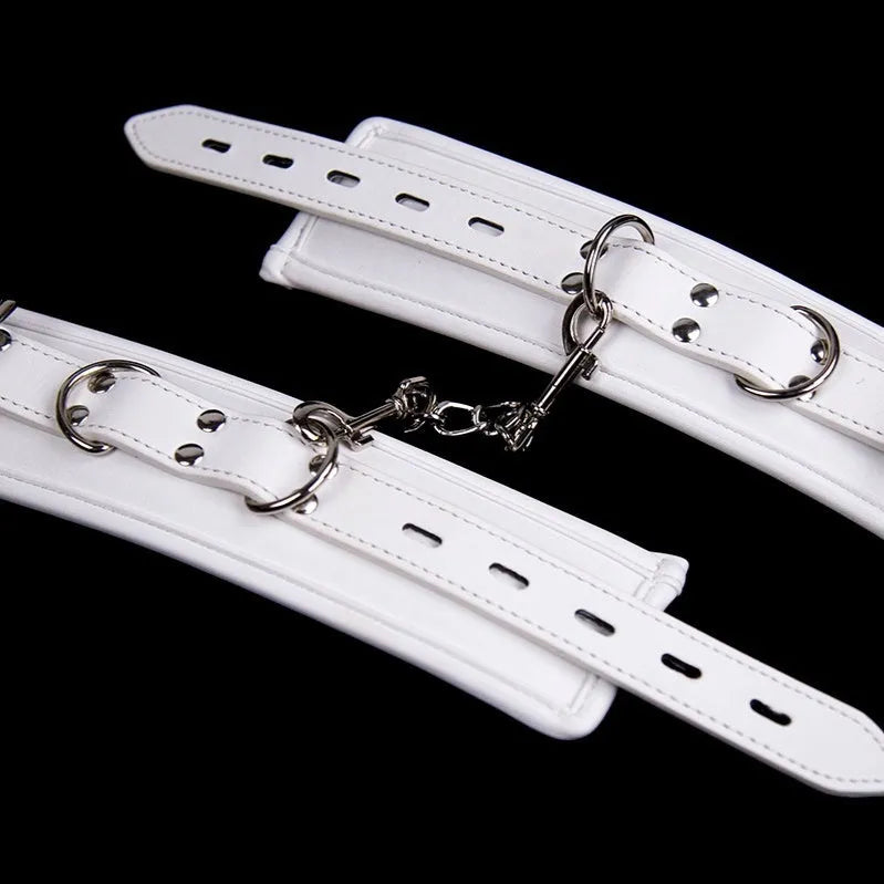 White PU sponge bondage restraint set showing wrist cuffs, ankle cuffs and neck cuff