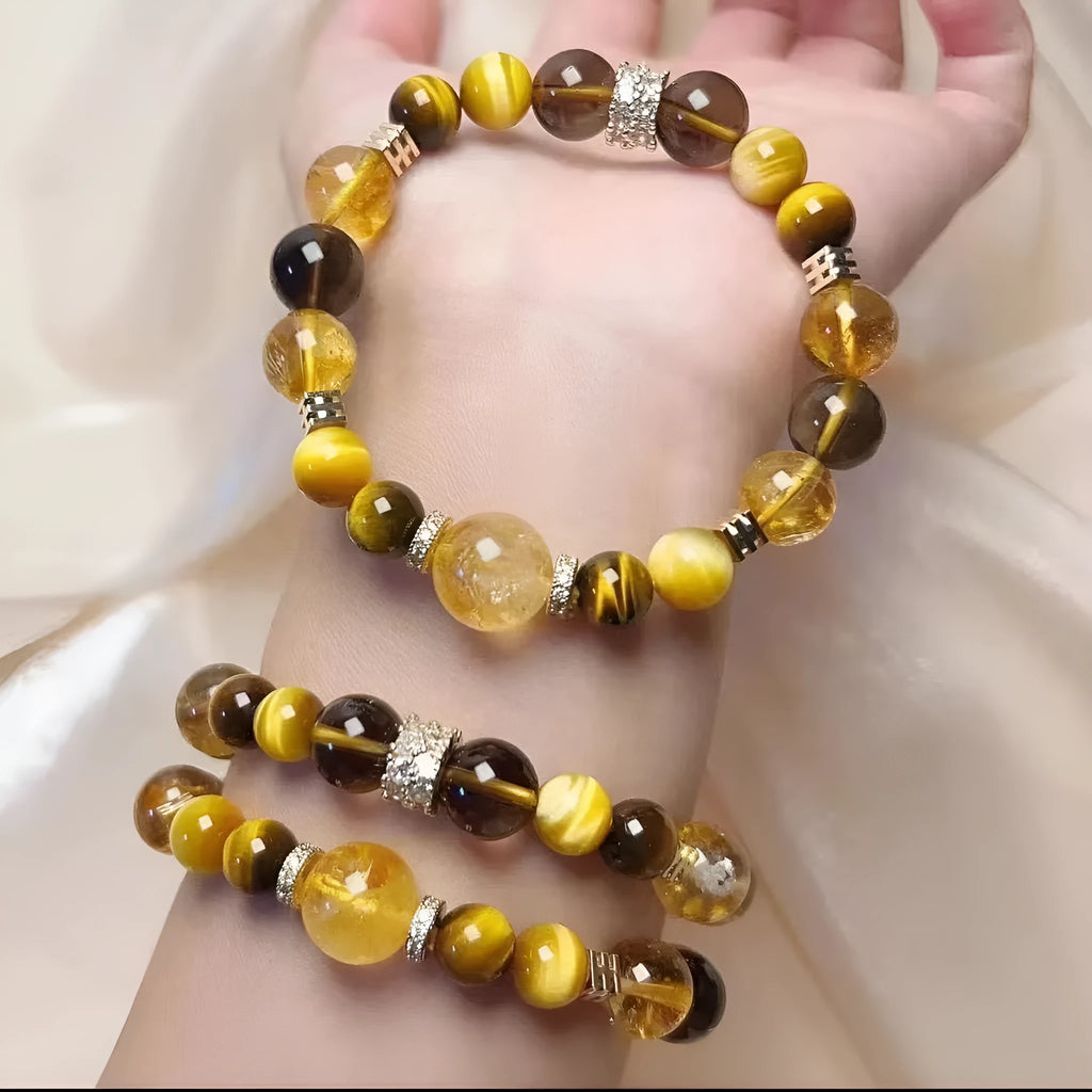 Women's natural yellow 10mm artificial crystal string beads bracelet on wrist.
