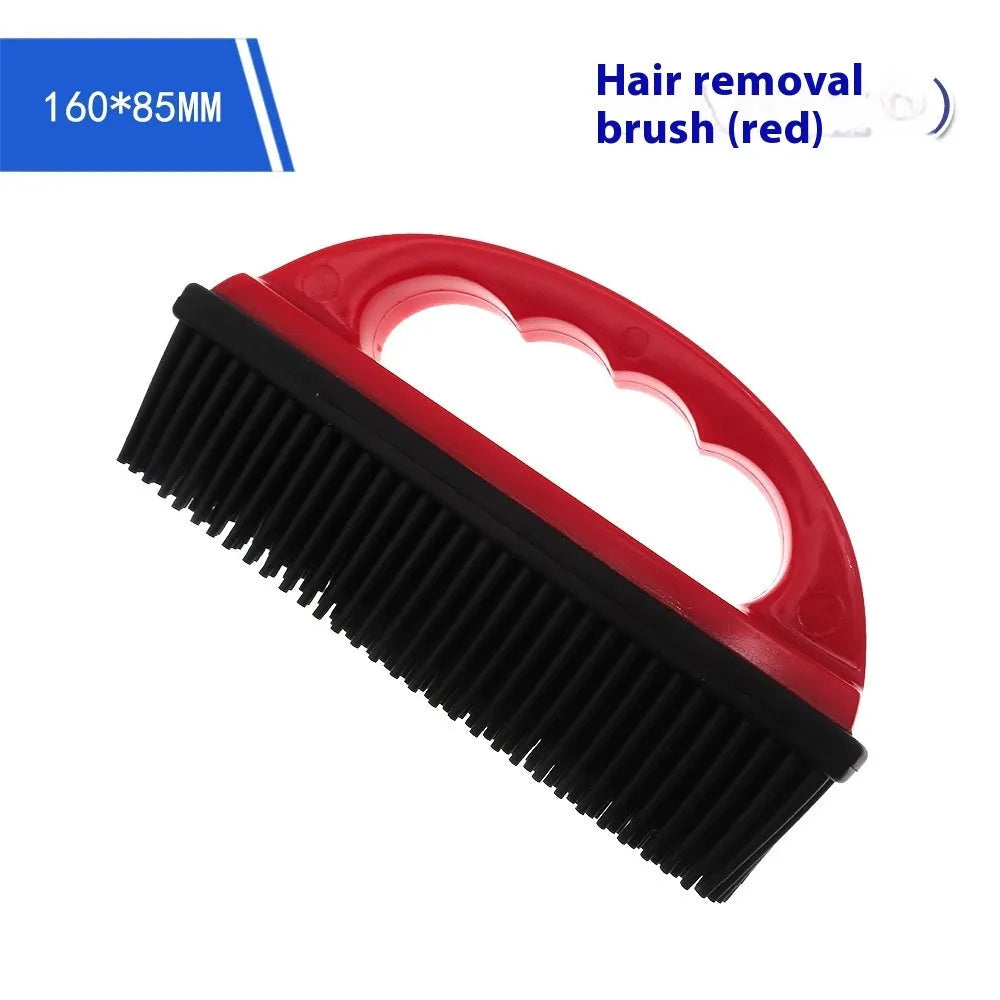 Red handheld pet hair removal brush with rubber bristles for grooming dogs and cleaning carpets.
