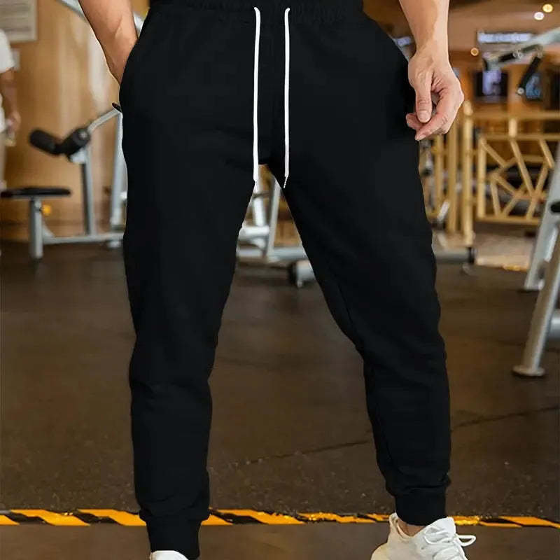 Men's loose-fit casual trousers with elastic lace waistband in a choice of three colours.