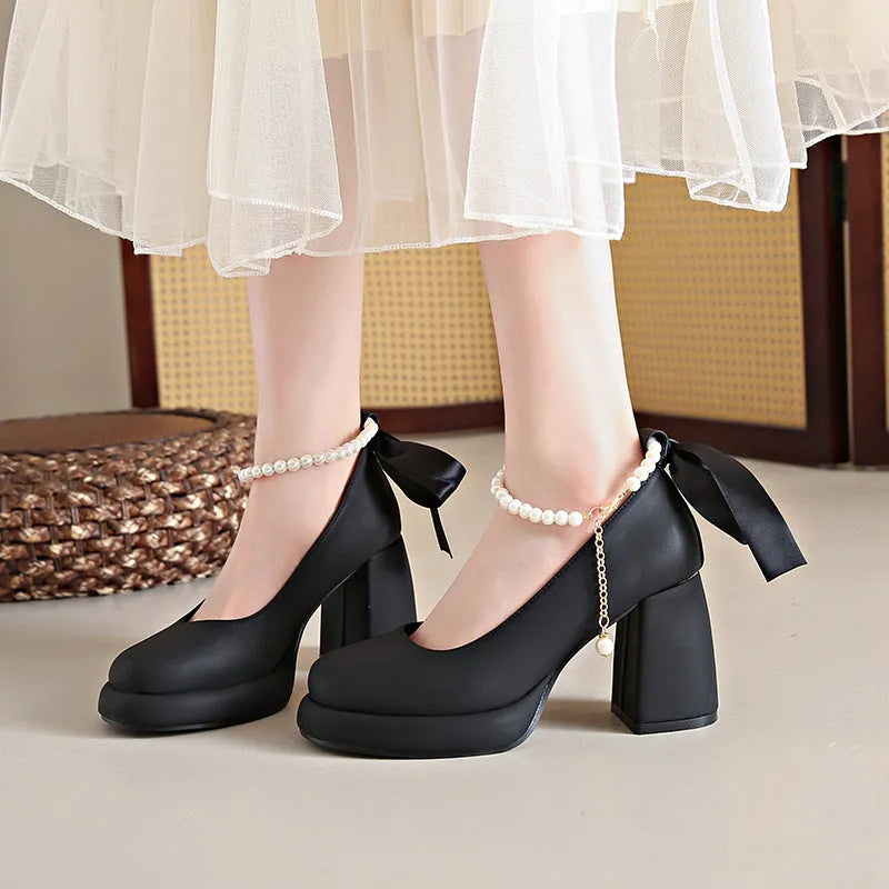 Women's beige Mary Jane shoes with a chunky heel and silver ankle-strap buckle on a round toe PU upper.