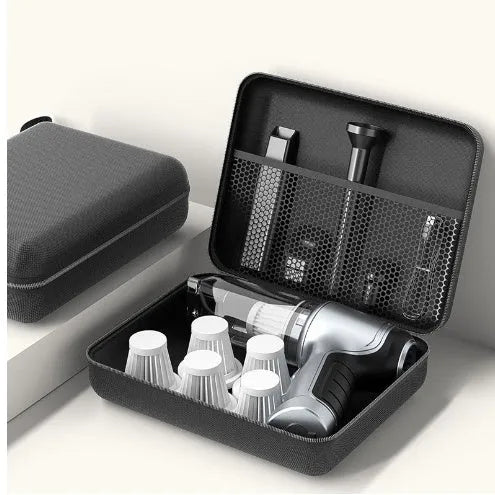 A handheld cordless vacuum cleaner with a car mount, shown on a car seat.