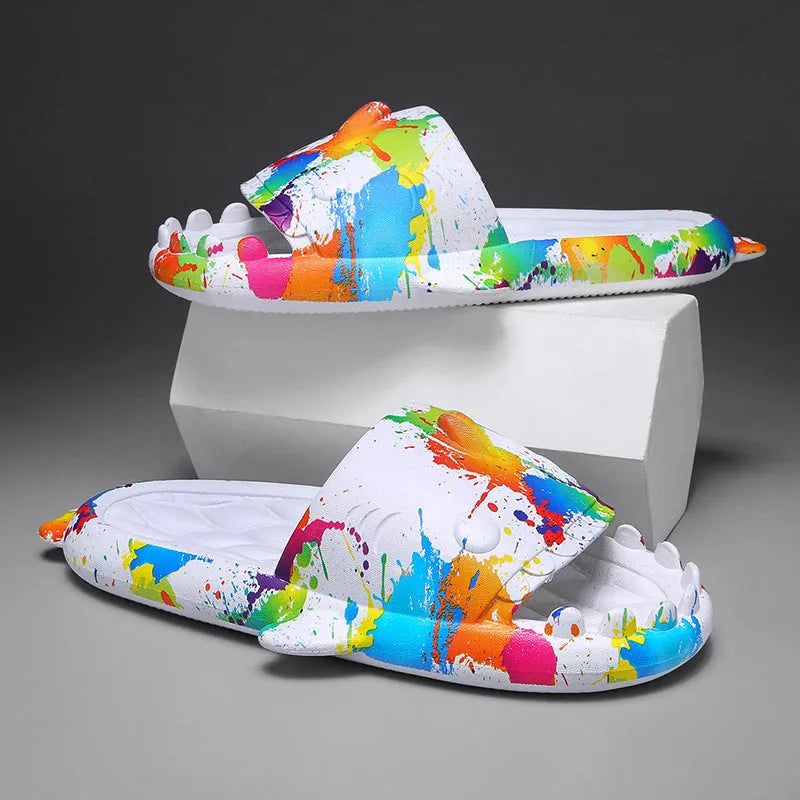 EVA open-toe shark-themed couple slippers in assorted colours on a white background.