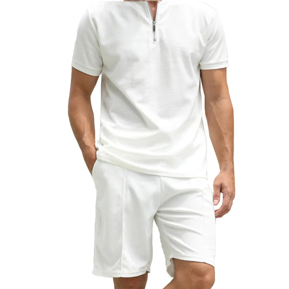 Men's solid colour short sleeve polo shirt and trousers two-piece set on a hanger.