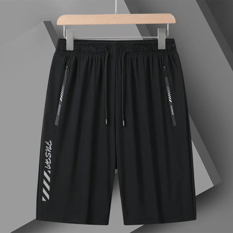 Man wearing black loose-fit quick-dry nylon sports shorts for summer activities