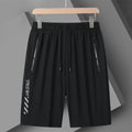 Man wearing black loose-fit quick-dry nylon sports shorts for summer activities