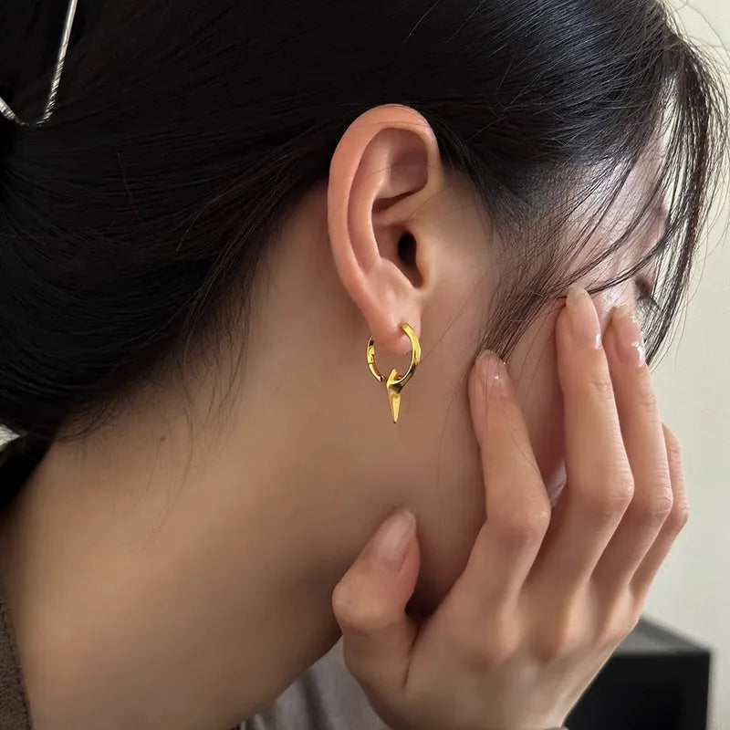 Geometric star-shaped ear clips with electroplated platinum finish on copper construction