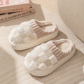 Women's plaid patterned plush slippers with coral velvet upper and non-slip PVC sole in coffee colour.