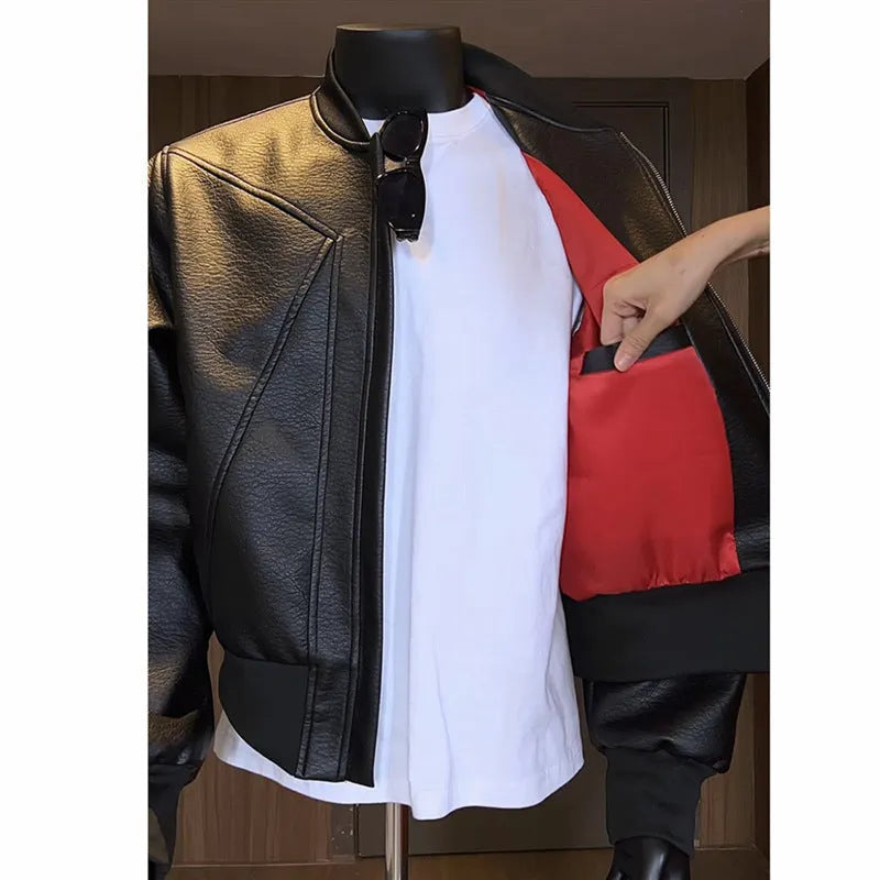 Men's black PU leather jacket with extended length and slim fit design shown from front