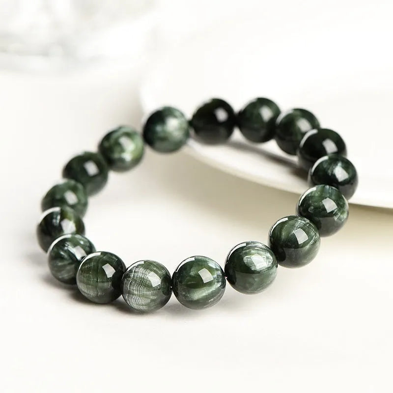 A single-ring green dragon crystal bracelet with round beads and a ruyi design element.
