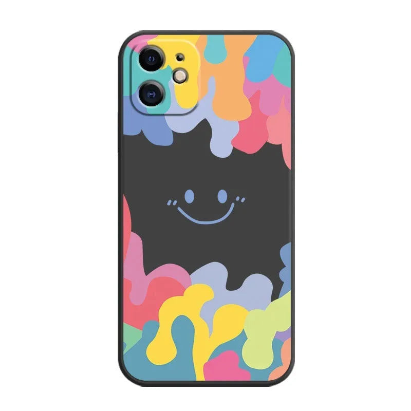 White TPU iPhone case with rainbow smiley faces on top and bottom, includes a black lanyard.