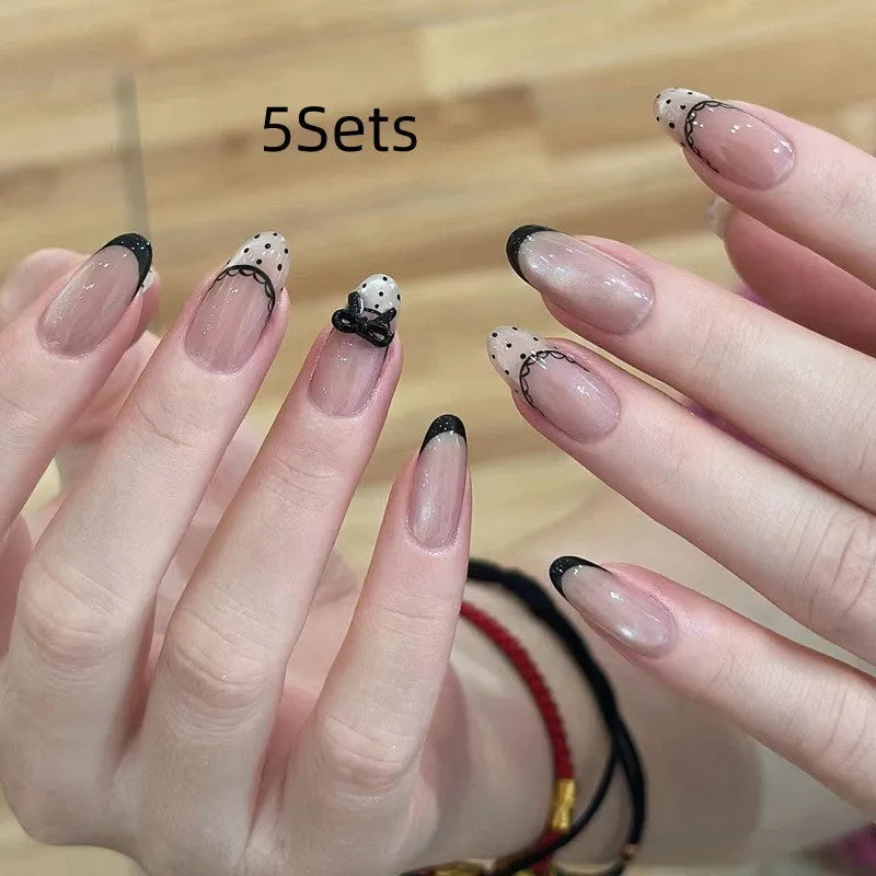 Set of sweet girl theme fake nails with colourful glitter and crystal decorations on a soft gel base.