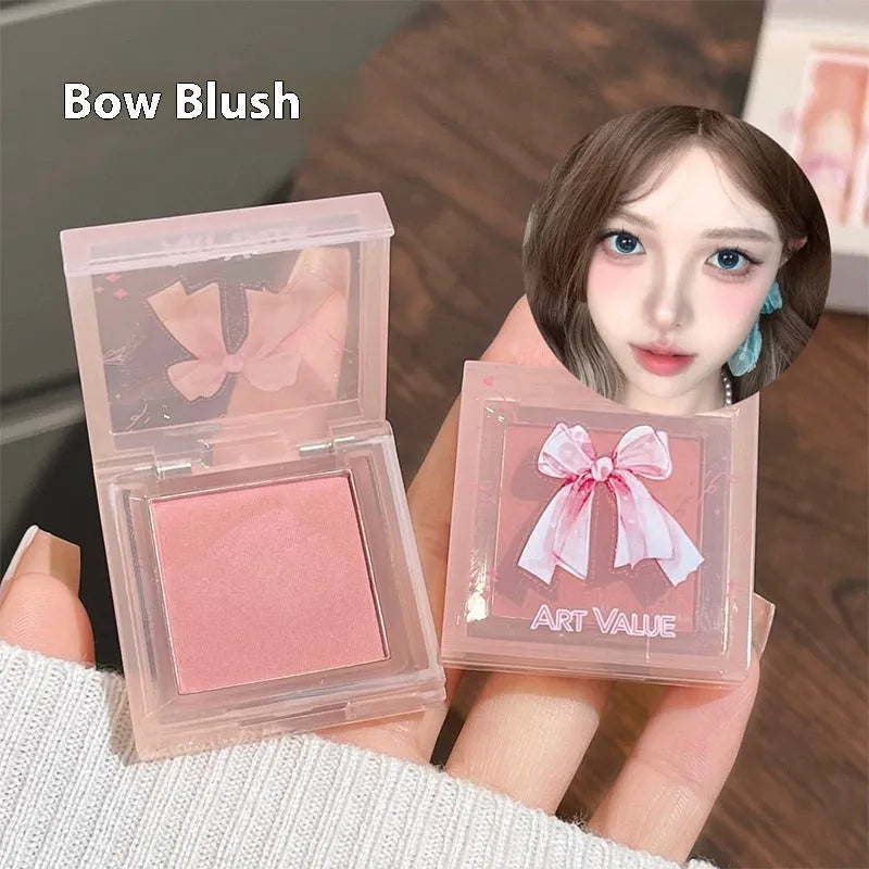 Butterfly box makeup set containing four matte lip mud tubes, powder blusher compact and adjustable necklace