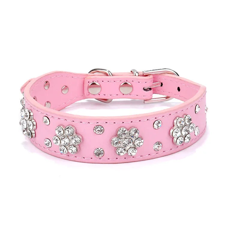 PU leather dog collar with rhinestone flower pattern and metal D-ring on a white background