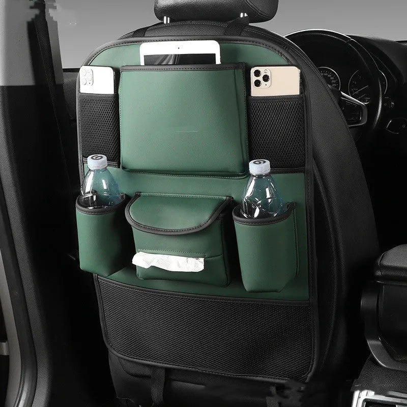 A leather car seat back storage bag hanging behind a vehicle seat.
